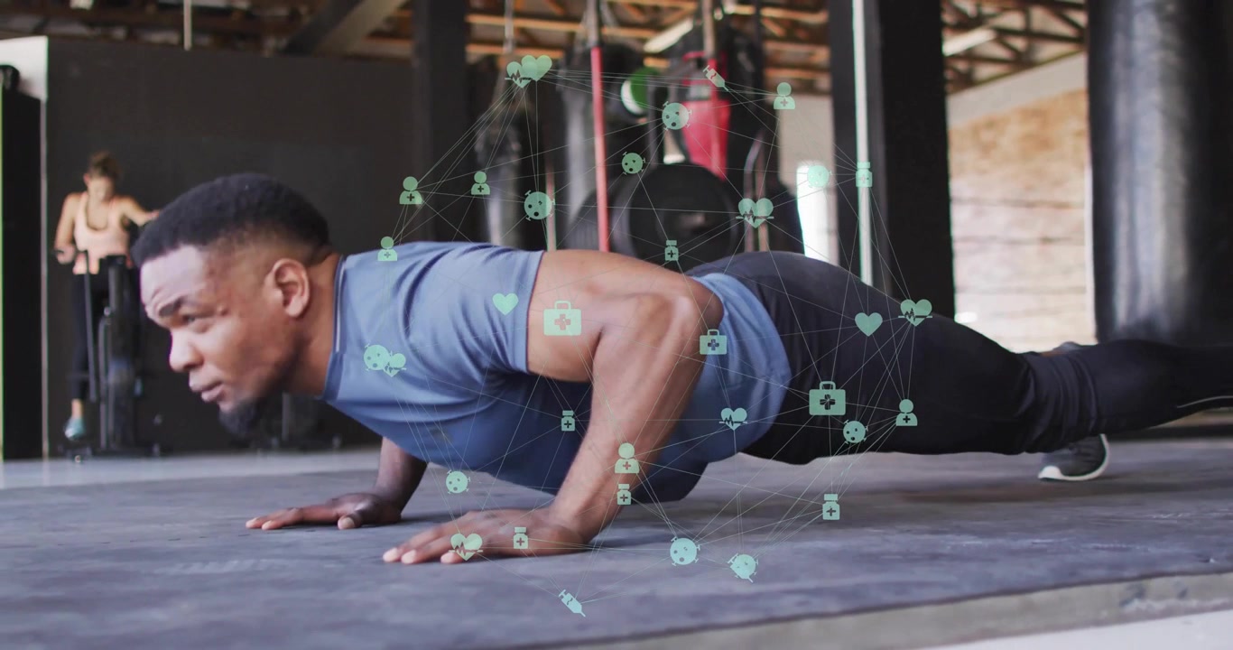 Man lowering into push-up position on mat, health-tech icons pulsing tracking strength