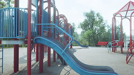 empty swings on summer kids playground