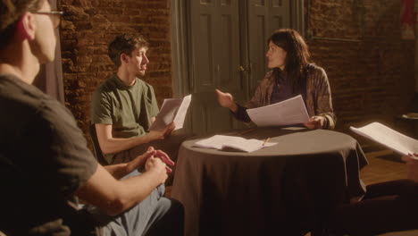 drama students preparing for theater performance with stage director