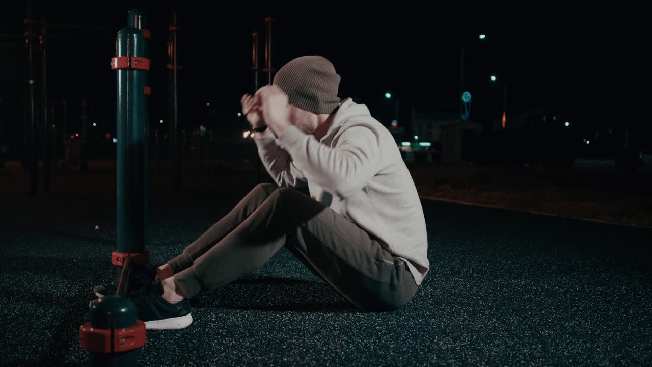 Man Exercising at Night in a Park