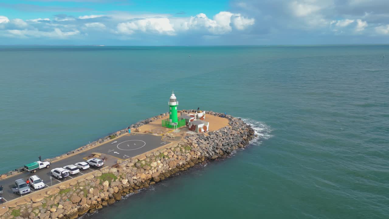 Cinematic drone footage panning around and towards the South Mole Lighthouse in Fremantle, Perth, Western Australia