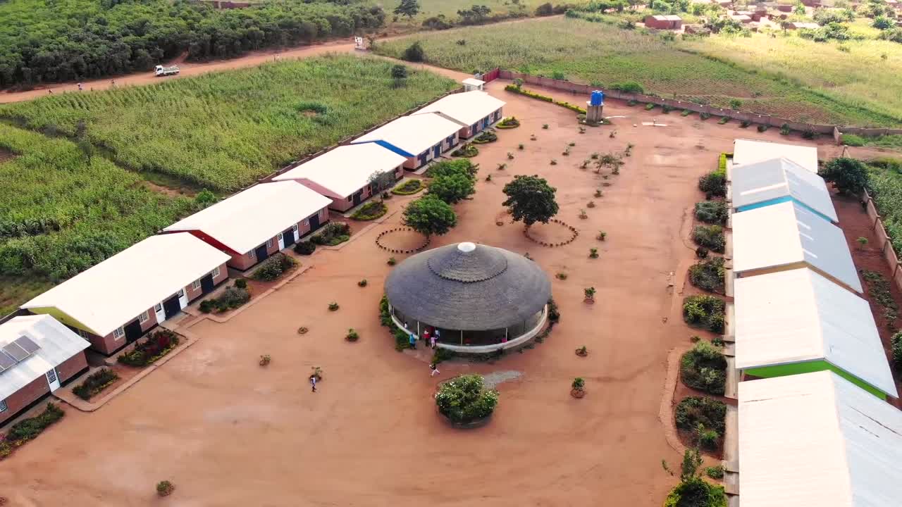 African Children Playing Football in Refugee Camp, Central Square, Aerial
