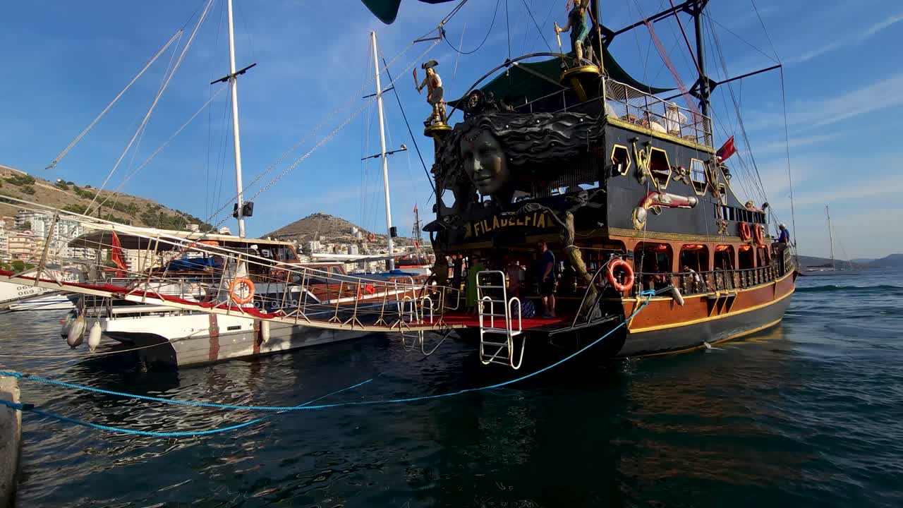 Tour Ship Anchored at Saranda Coastal Pier, Creating a Seaside Spectacle for a Summer Vacation of Leisure