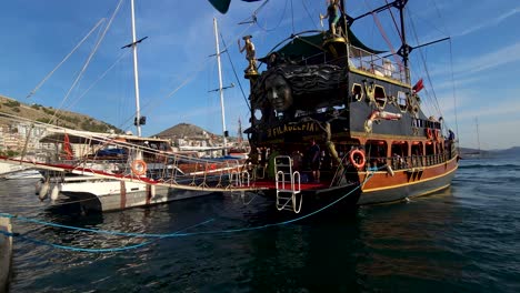 Tour-Ship-Anchored-at-Saranda-Coastal-Pier,-Creating-a-Seaside-Spectacle-for-a-Summer-Vacation-of-Leisure