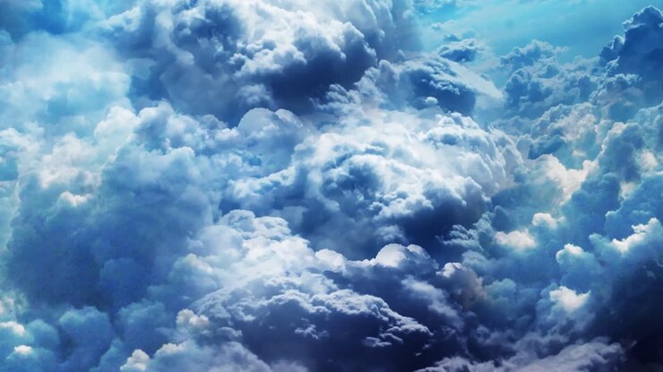Flying through a cloud tunnel of white and blue storm clouds - great intro or title sequence, cinematic animation background in 4K