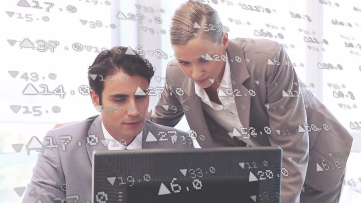 Animation of financial data over caucasian businesspeople using computer