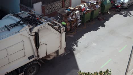 garbage truck collecting waste