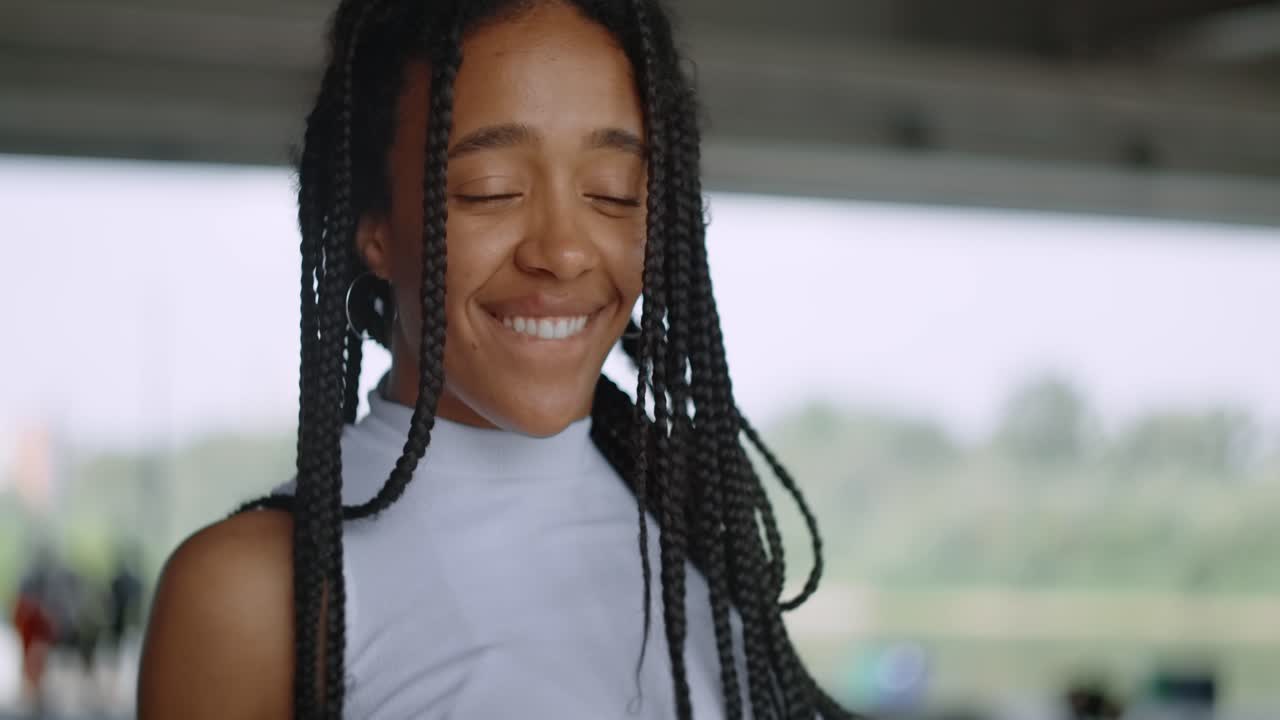 Smiling Young Woman with Braids