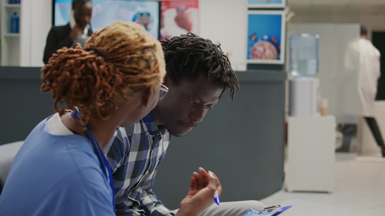 Nurse explaining diagnosis to male patient