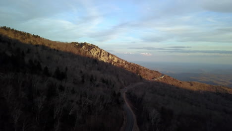 aerial at sunset of rough ridge in the background as it lies beside the blue ridge parkway in the mountains of north carolina