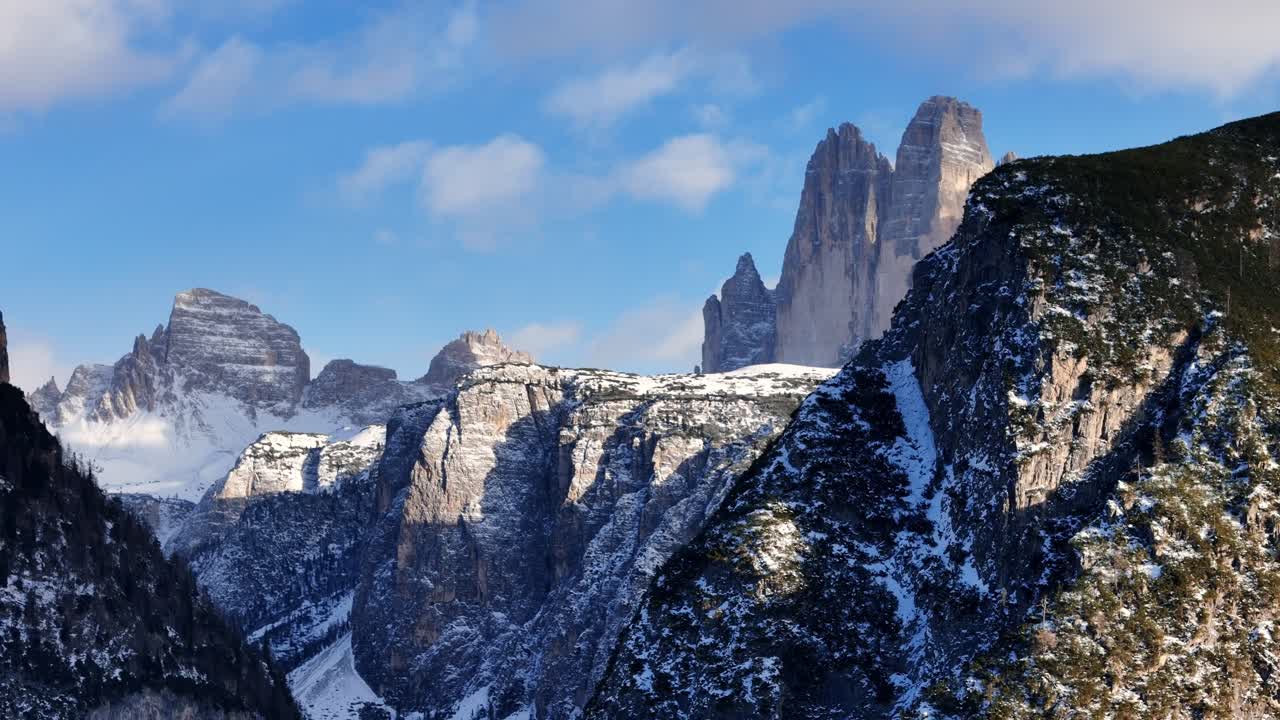Reveal of the Drei Zinnen in the Italian Dolomites during winter season (drone footage)