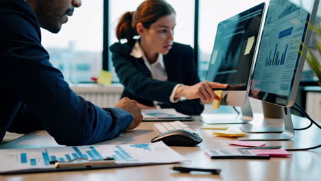 people working in a modern office, collaborating on data analysis and business tasks