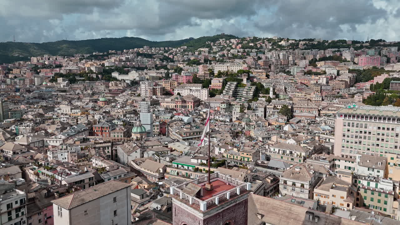 St Georges red cross flag waves atop Grimaldina tower in historic center, aerial