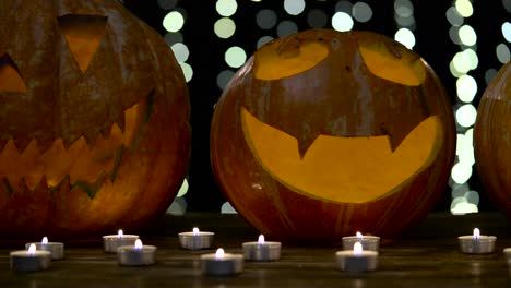 various halloween pumpkin with scary face with with a burning candle