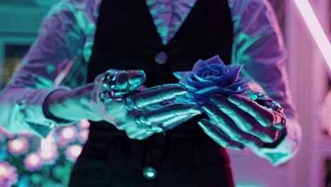 robotic hands holding a blue rose