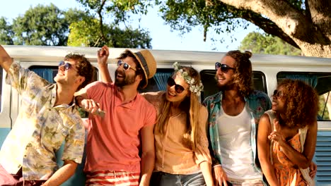 group of hipster friends taking a selfie