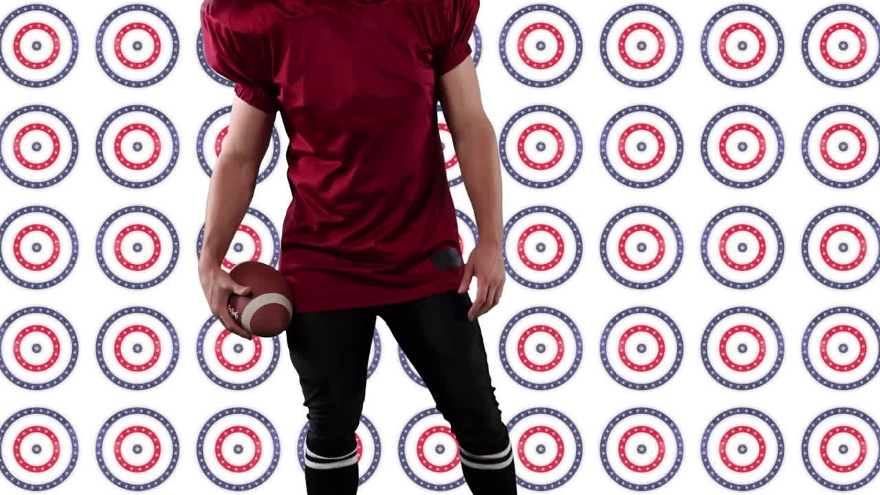 sección media de un jugador de rugby sosteniendo una pelota de pie contra múltiples estrellas en círculos giratorios