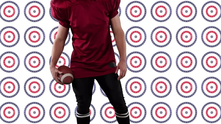 Mid section of rugby player holding a ball standing against multiple stars on spinning circles