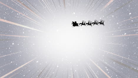 snow falling on santa claus in sleigh being pulled by reindeers and light trails on grey background