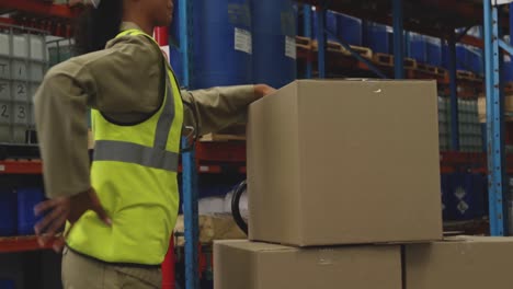 young female male worker in a warehouse