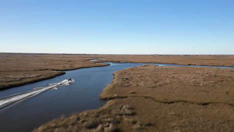 Aerial-view-of-recreational-fishing-boat-through-New-Orleans-channels