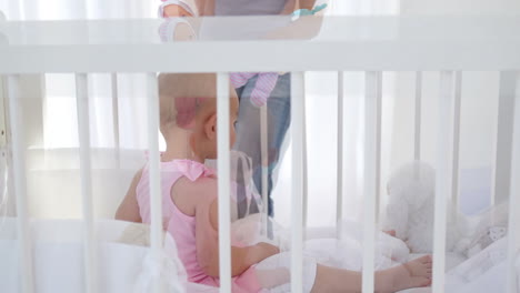 woman giving dolls to a baby