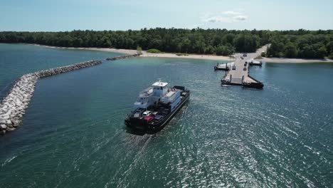 the washington island car ferry approaches the pier at northport, wisconsin located on the far north shore of the door county peninsula located between lake michigan and the bay of green bay