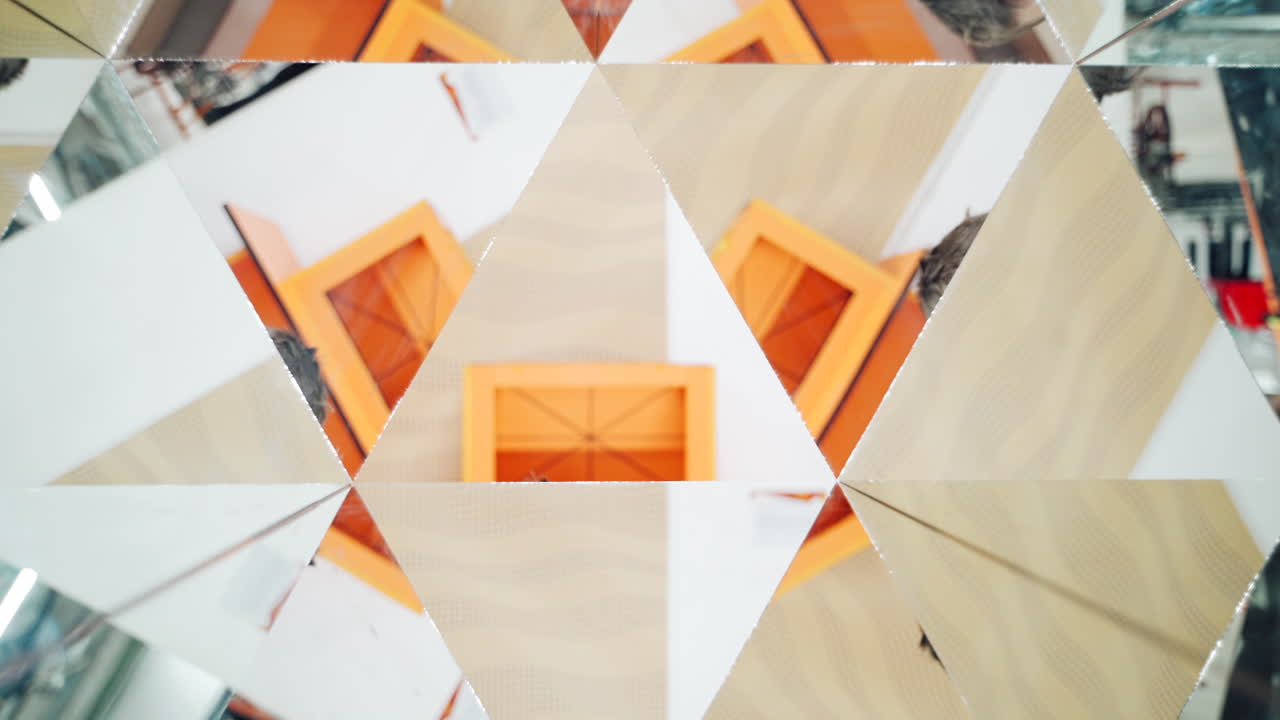 World of reflections of child. Child in a kaleidoscope tunnel. Museum of Science