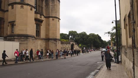 a group of people walking in oxford