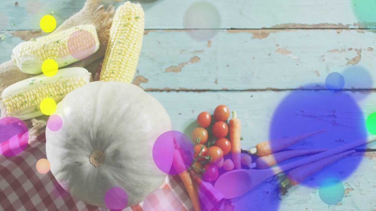 Initially, colored circles drifting upward on vegetable display converging fading to reveal produce