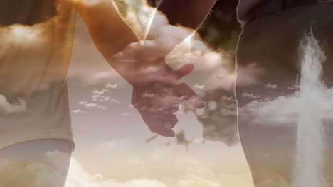 animation of a christian cross over a couple holding hands