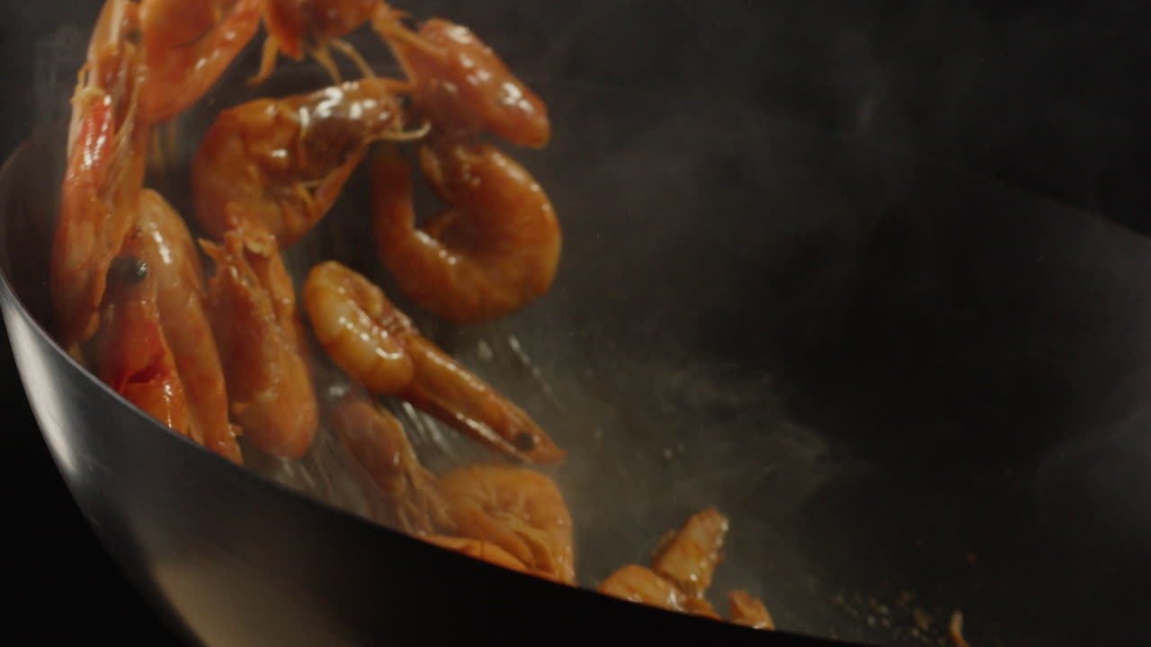 Cooking in a Wok with Flames and Smoke