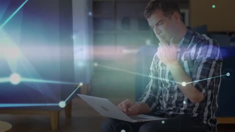 Glowing network of connections over thoughtful caucasian senior businessman using laptop at office