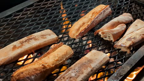 Toasting-bread-rolls-on-charcoal-BBQ