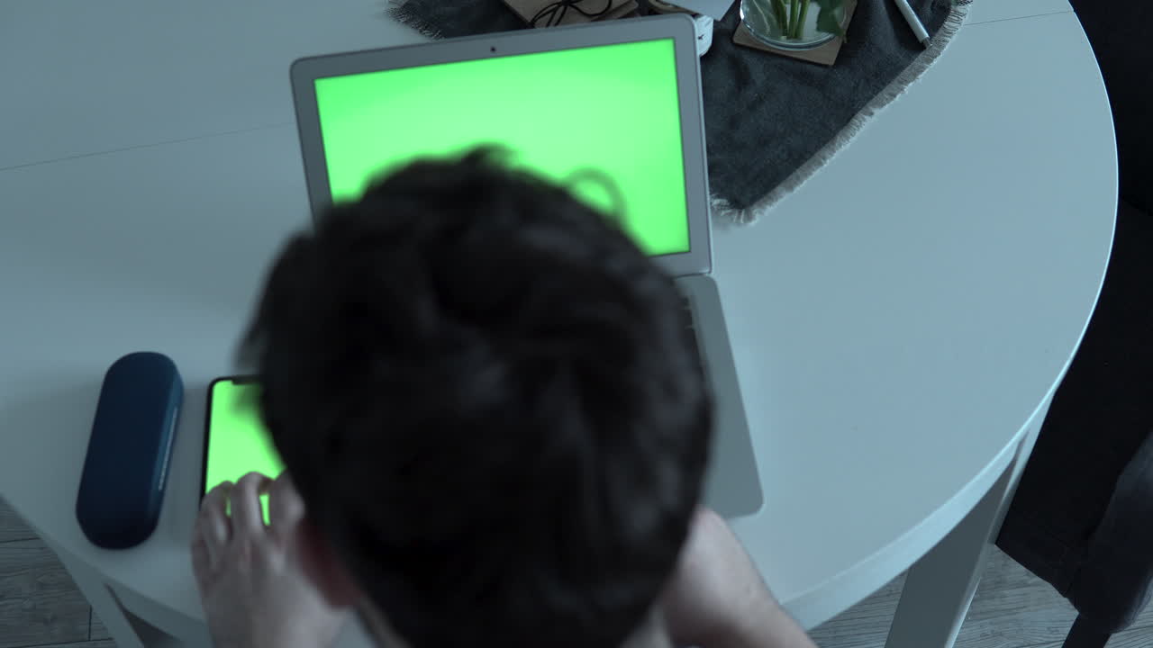 Home office time, touching and tap mobile phone screen, sitting on table at home