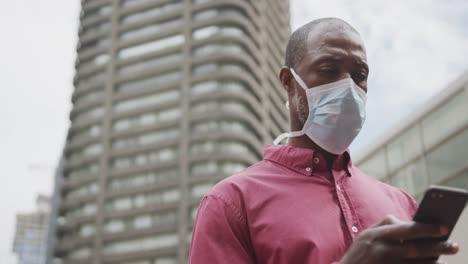 african american man on the go wearing coronavirus covid19 mask