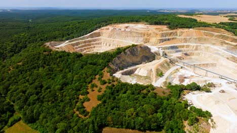 Open-Cast-Mining-Quarry-With-Green-Lake---aerial-drone-shot