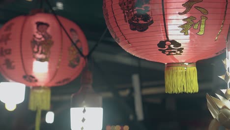 wind waves asian lanterns under ceiling in cafe at night