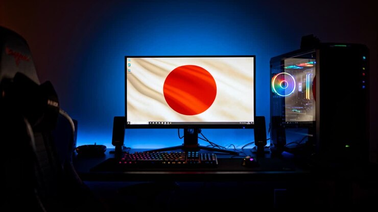 Illuminazione RGB ciclica che anima il monitor e la torre del PC alla scrivania, enfatizzando il cerchio rosso e la tastiera