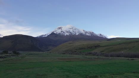 snow-capped volcano chimborazo in ecuador, aerial fly forward view