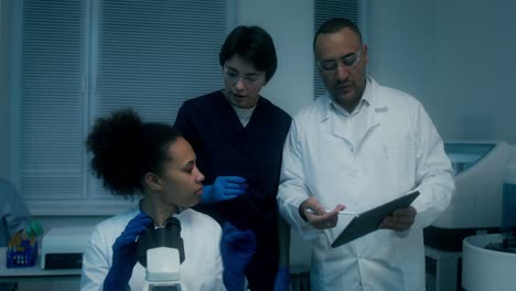 scientists discussing results in a laboratory