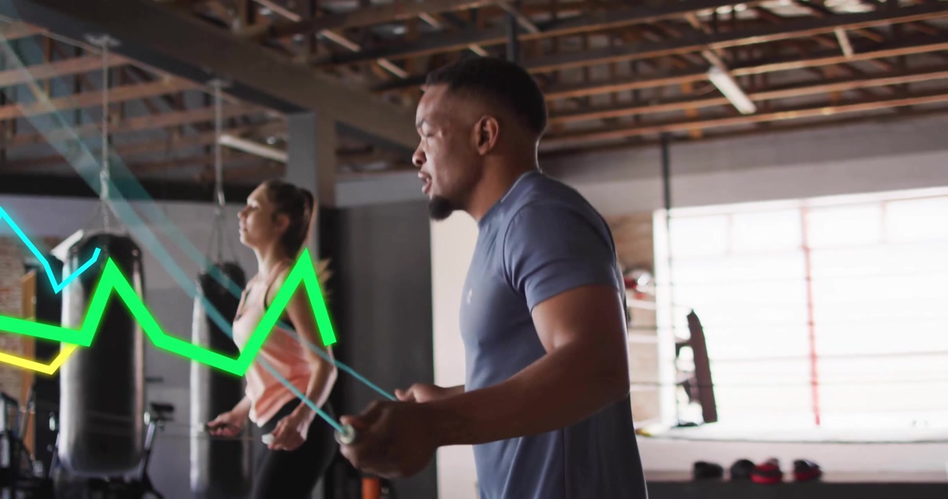 Workout partners rotating jump ropes on cue, generating animated graphs spiking and leveling off