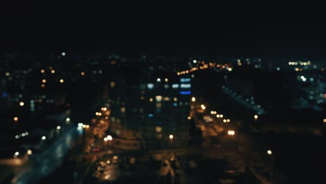 blurred night city background with colored bokeh. view of the city from a height out of focus