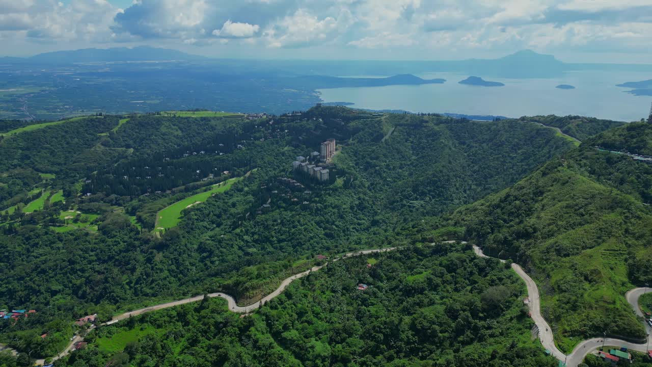 A close aerial of the road leading to People's Park in the Sky with The Woodlands in the background in Tagaytay, Cavite, Philippines