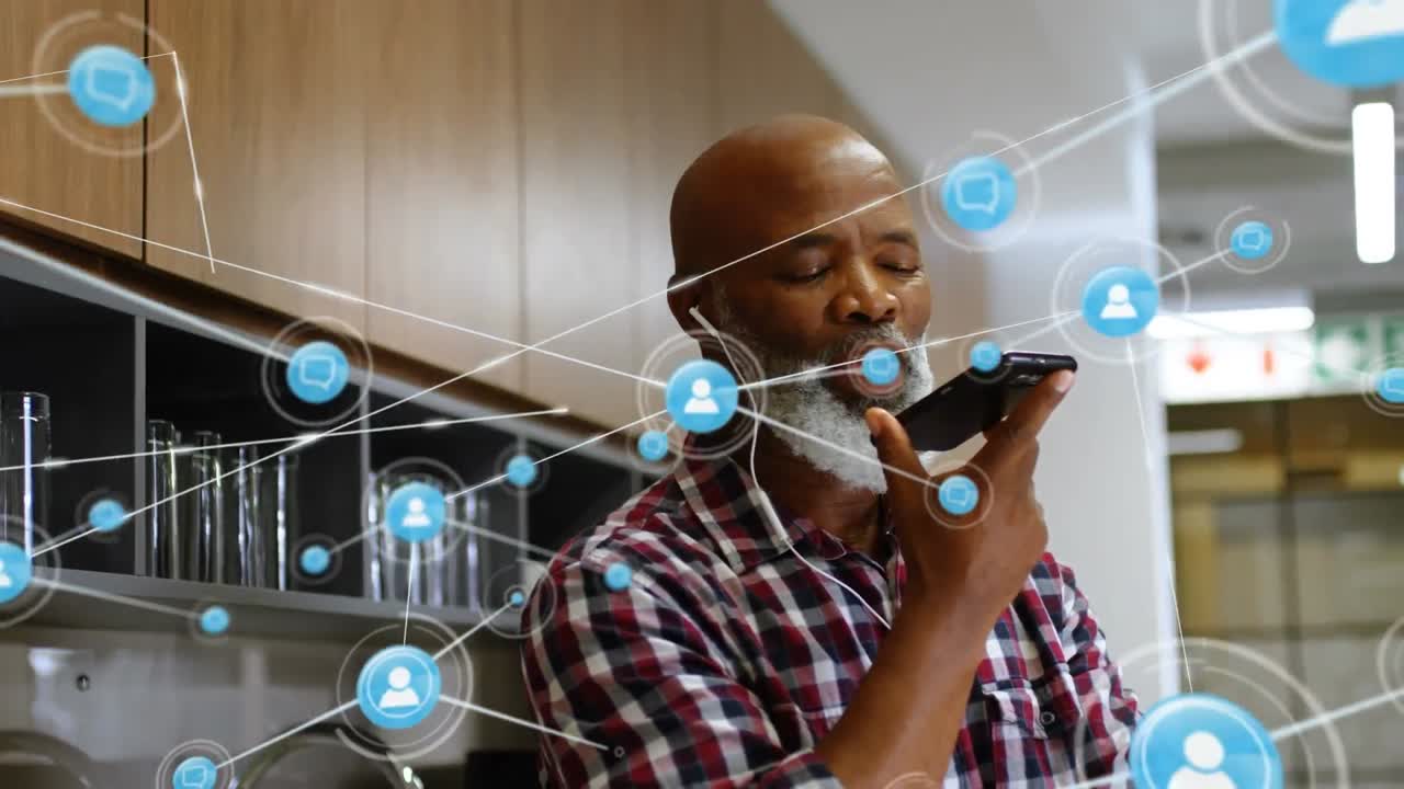 Animation of network of connections with icons over businessman using smartphone