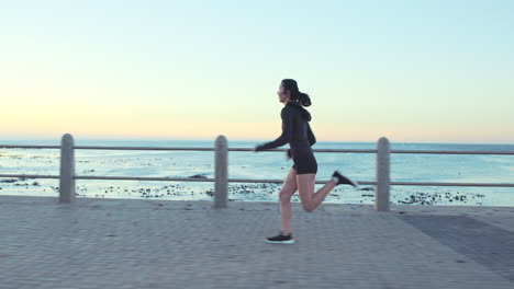 fitness, running and woman at the beach