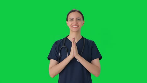 happy indian female doctor doing namaste green screen