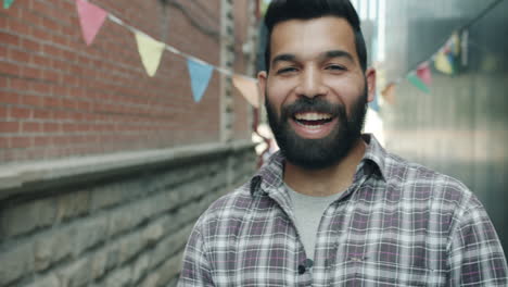 happy man in an urban alley
