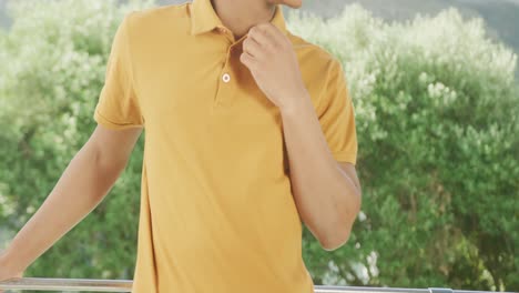 Slow-motion-video-of-african-american-man-wearing-yellow-polo-shirt-with-copy-space