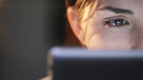 woman-using-tablet-computer-touchscreen-close-up